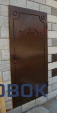 Фото Дверь металлическая с элементами ковки