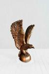 фото Скульптура орла на шаре в античной бронзе