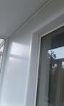 фото Обшивка балконной стены с откосами на балконный блок.